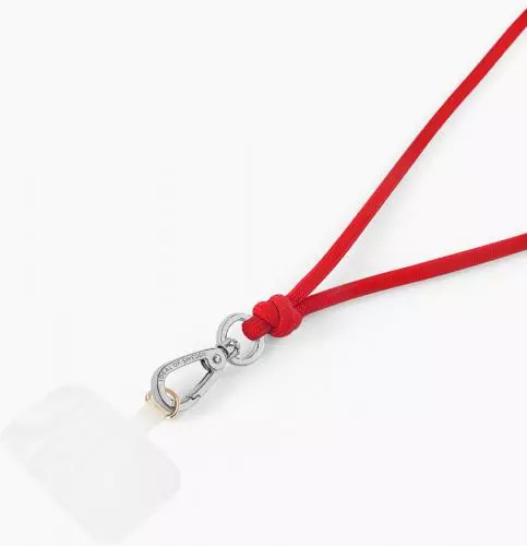 Ein roter Schlüsselanhänger mit Karabinerhaken und einem leeren, transparenten Etikett
